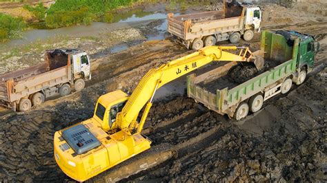 excavator scoops dump truck video